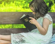 Children cherishing Scripture