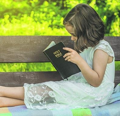 Children cherishing Scripture